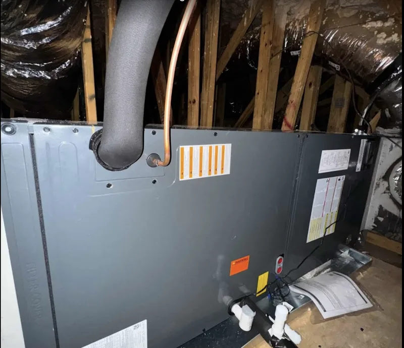 Smart Home Air & Heat technician repairing a furnace heating system in Maitland FL