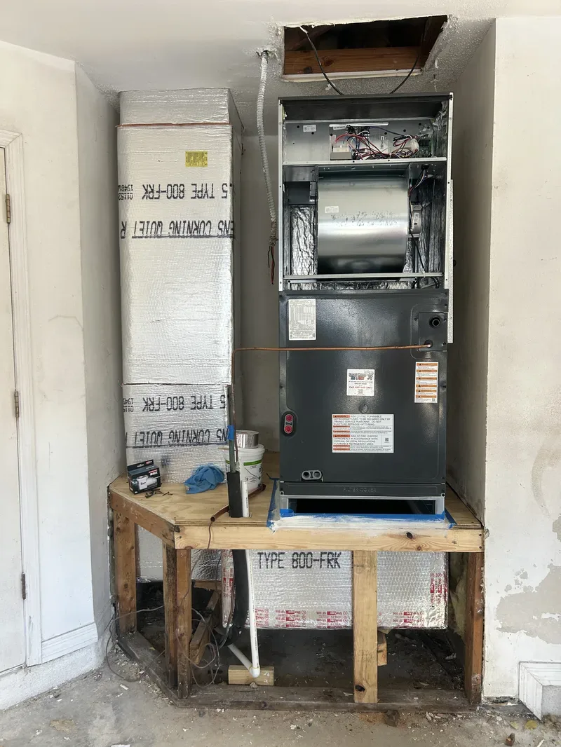 Smart Home Air & Heat technician repairing a furnace heating system